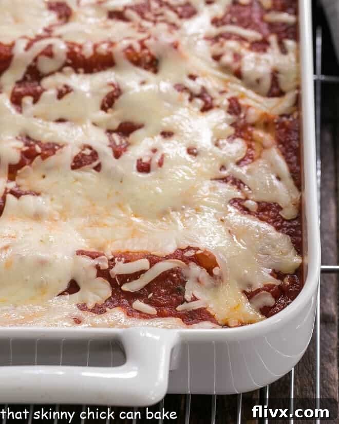 Close up of manicotti in a casserole dish.