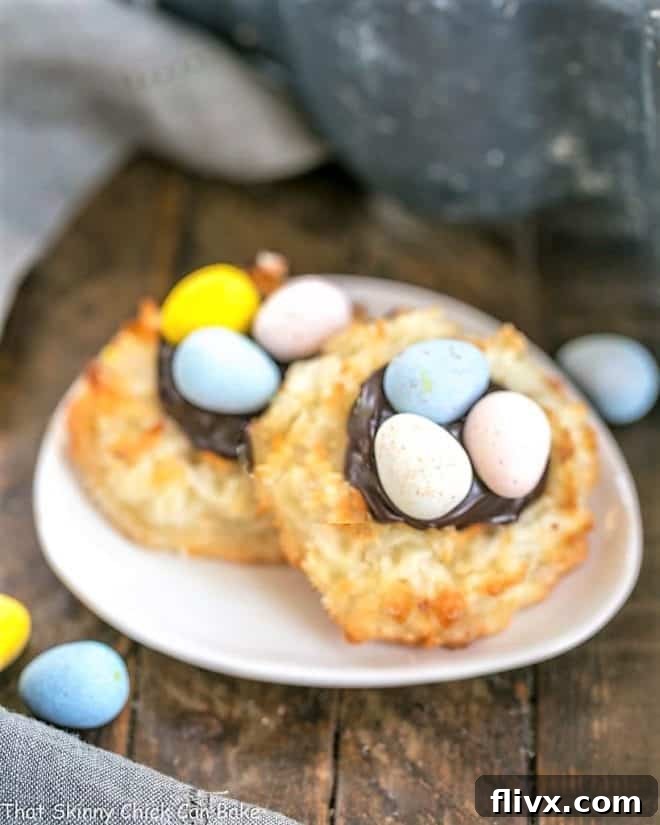 Two Coconut Macaroon Easter Nests on a small oval dish, showcasing their delicious filling and candy eggs.