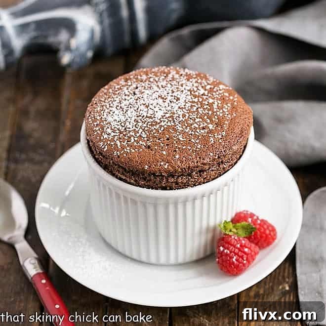 Individual Chocolate Soufflés featured image, perfectly risen in a white ramekin.