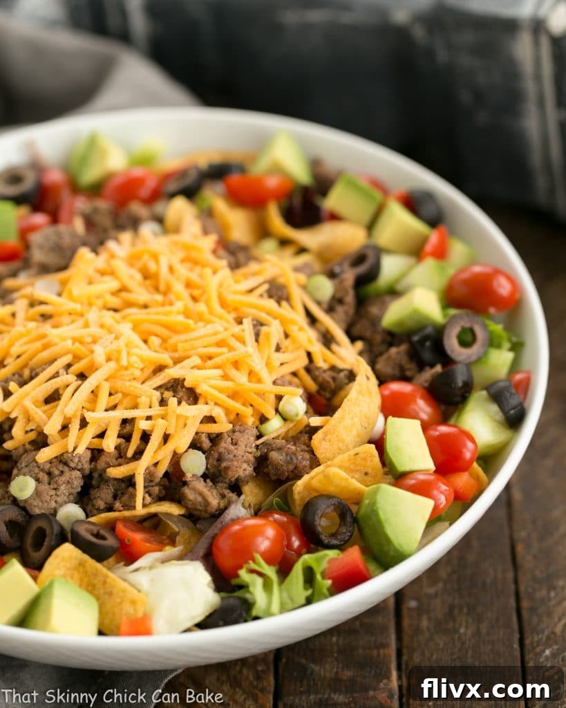 Beef Taco Salad with Salsa Dressing in a white ceramic bowl