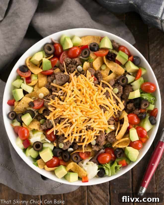 Overhead view of Beef Taco Salad with Salsa Dressing in a white serving bowl