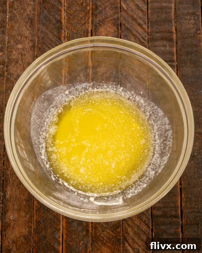 Melted butter for frosting in a bowl.