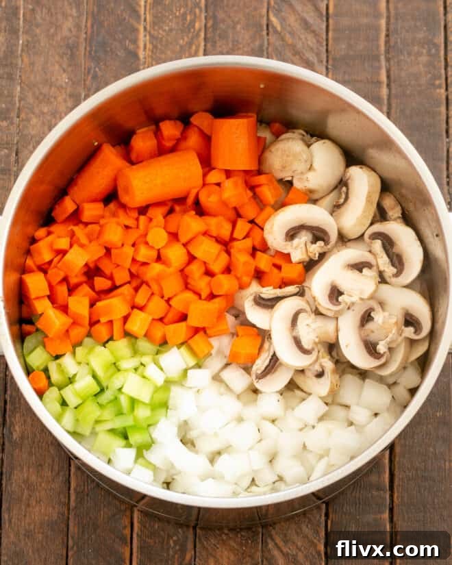 Step 2: Sautéing chopped onions, carrots, celery, and mushrooms in a Dutch oven until softened and fragrant.