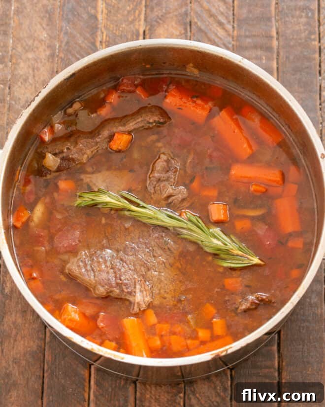 Step 6: Removing the cooked roast to rest, adding rosemary to the liquid, reducing the sauce, and then cutting and serving the tender beef.