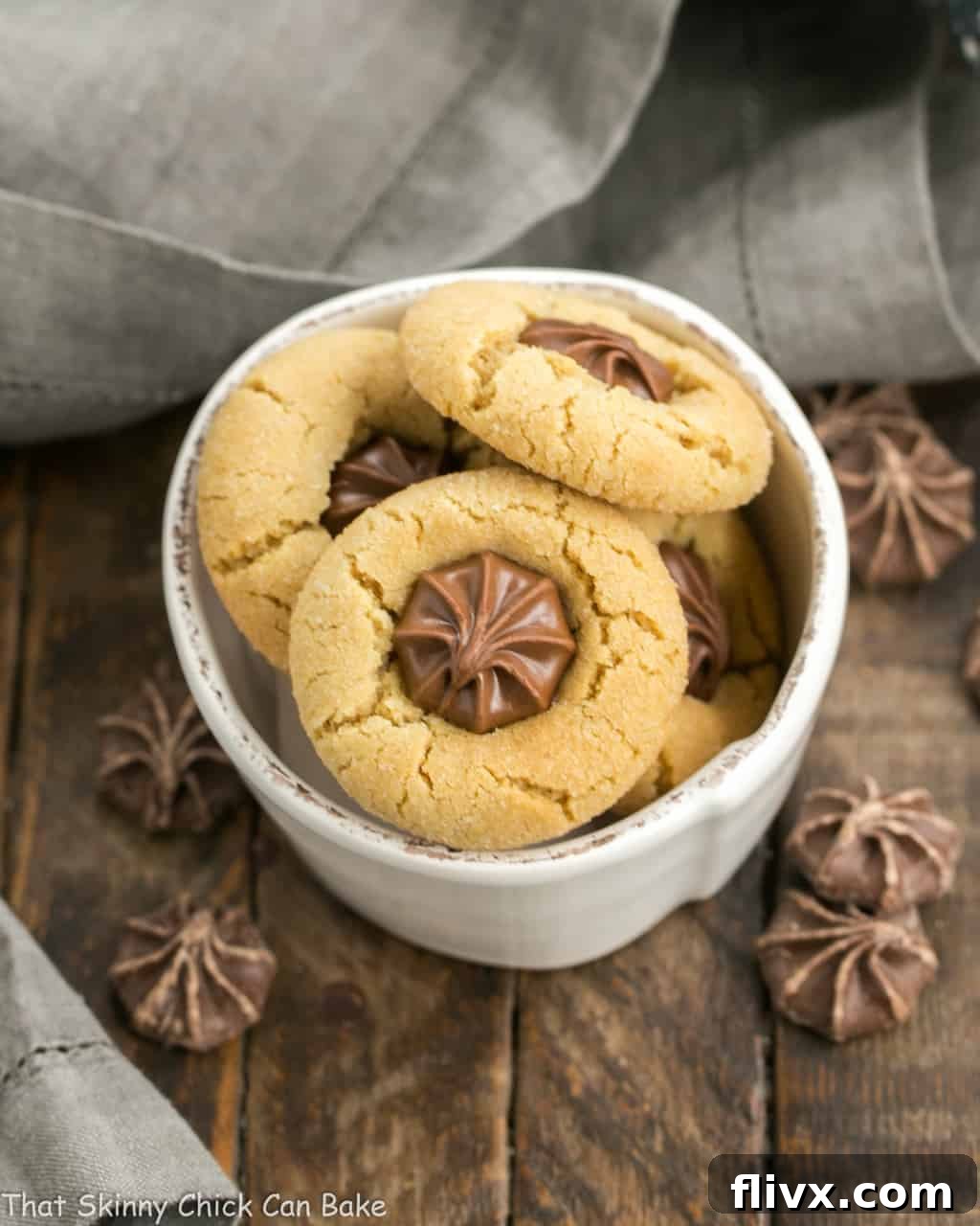 Festive Star of Bethlehem Peanut Butter Blossom Cookies in a small white bowl, ready for holiday celebrations.