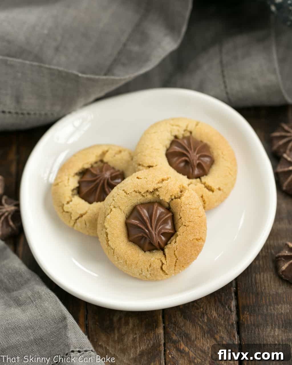 Star of Bethlehem Cookies, a festive twist on Peanut Butter Blossoms, arranged beautifully on a small white plate, highlighting their holiday appeal.