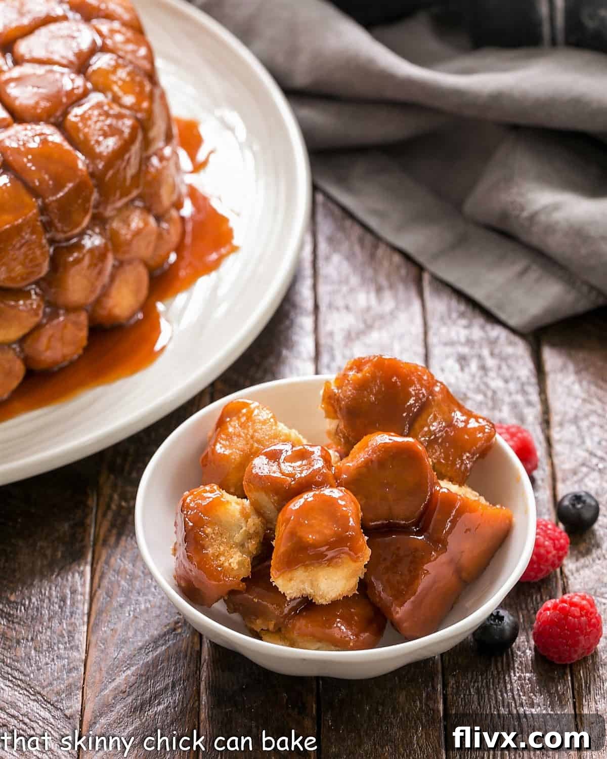 A visually stunning close-up of Monkey Bread in a pristine white ceramic bowl, showcasing its golden-brown exterior and individual pull-apart sections, ready to be enjoyed.