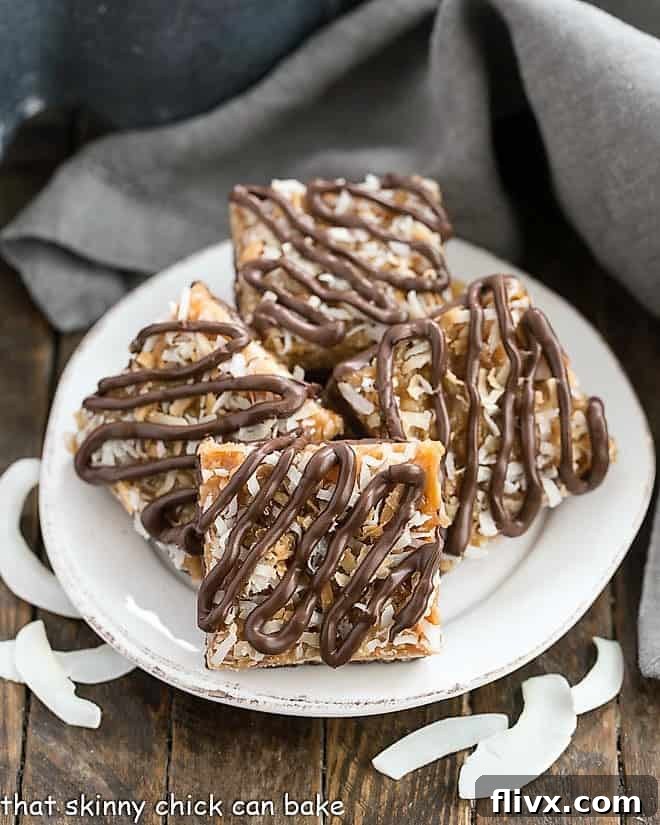 Homemade Samoa Bars on a round white plate, perfectly cut and ready to serve.