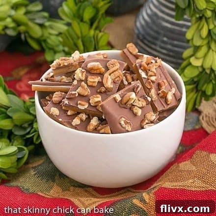 Classic English Toffee in a round white bowl, perfect for sharing as a holiday treat.