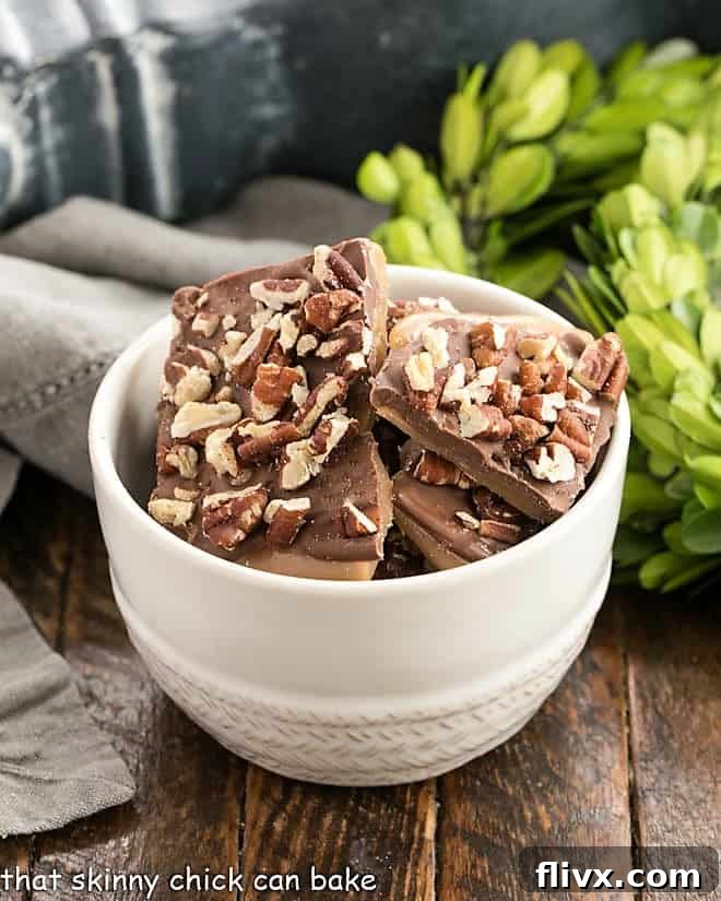 Classic English Toffee pieces artfully arranged in a white ceramic bowl, ready to serve.