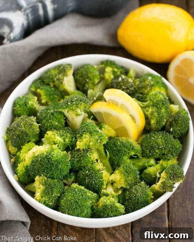 A close-up shot of a bowl filled with lemon garlic broccoli, highlighting the beautiful texture and vibrant color.