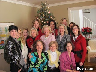 A top-down view of a tray of freshly baked Cranberry Bliss Bars, showing the intricate drizzle and cranberry topping.