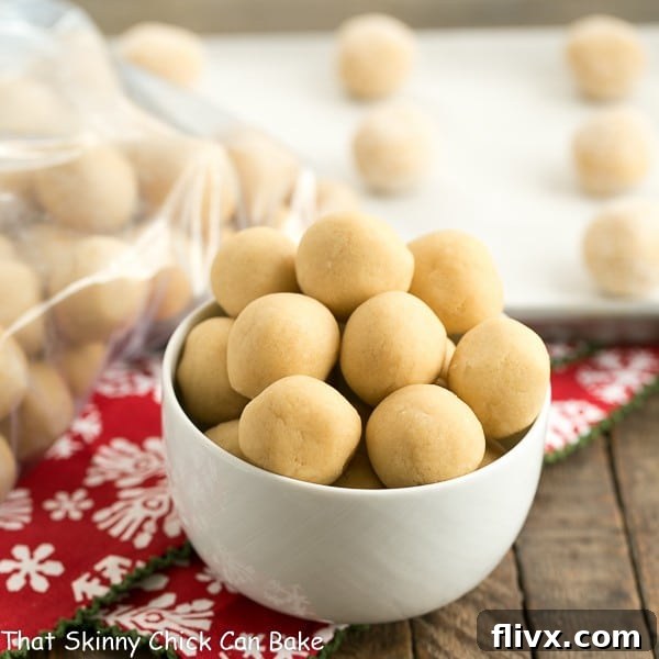 A bowl of neatly arranged cookie dough balls, ready for freezing, showcasing the smart prep for stress-free baking.