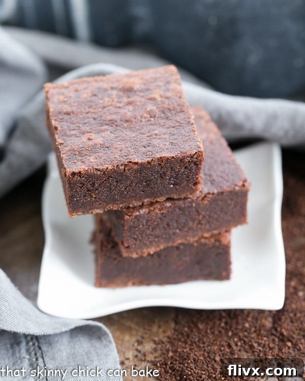 Palm Beach Mocha Brownies stacked on a small white plate