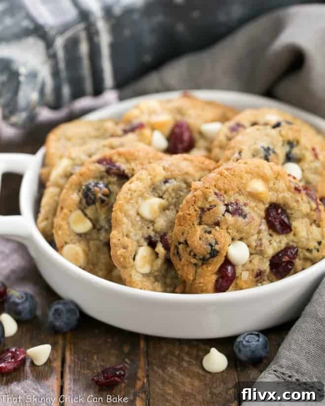 White Chocolate Chip Cookies with Dried Berries in a white ceramic terrine. 