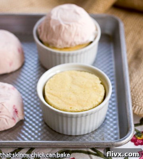 Individual Baked Alaskas - an elegant, retro dessert made of ice cream, pound cake and toasted meringue Step-by-step layering process for Individual Baked Alaskas: pound cake, strawberry ice cream dome, and meringue.