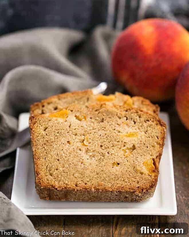 Multiple slices of fresh Southern Peach Bread are beautifully arranged on a square, white ceramic plate, ready to be enjoyed.