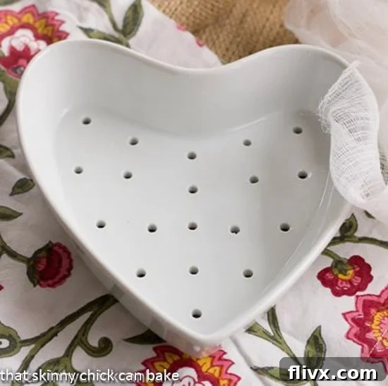 Coeur a la Creme dish on a floral napkin, beautifully presented