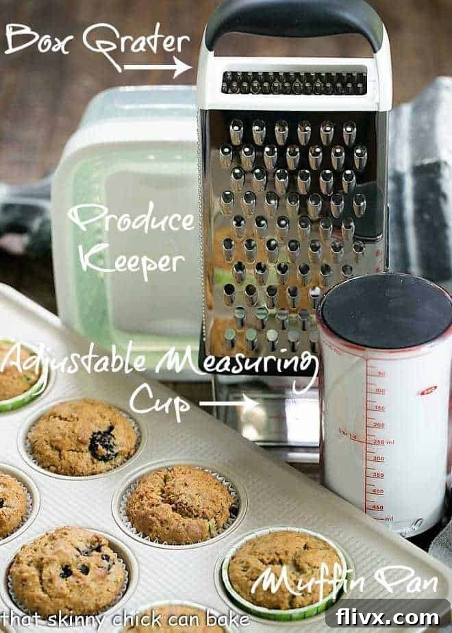 Various OXO kitchen tools neatly arranged around a batch of freshly baked Blackberry Bran Muffins