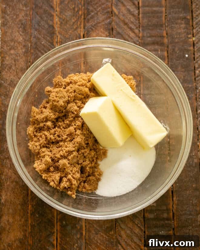 Step 2: Adding softened butter and both dark brown and granulated sugars to a large mixing bowl, ready for creaming.