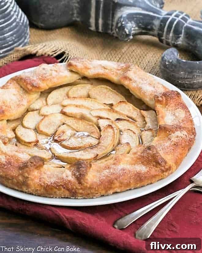 Maple Glazed Apple Galette, a rustic French tart with pastry folded over sweet apple slices.