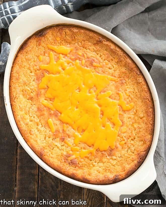 Easy Corn Casserole Recipe baked in a white baking dish, showing a golden brown top.