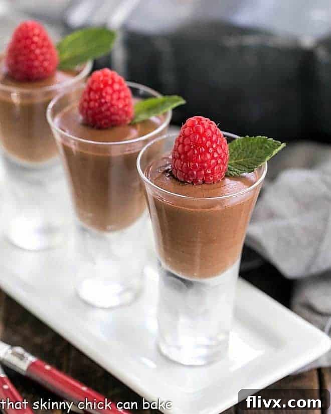 Decadent Chocolate Truffle Mousse, also known as Mousse au Chocolat, elegantly served in small decorative shot glasses.
