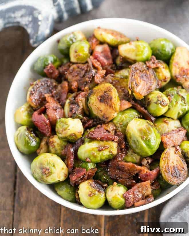 Maple Syrup Mustard Glazed Brussels Sprouts in a white serving bowl.