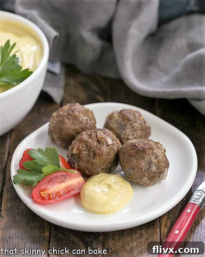 Indian Meatballs with Yogurt Sauce on a white appetizer plate