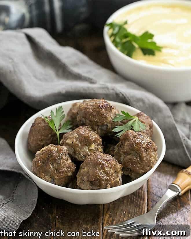 Grilled Beef Meatballs with Indian Yogurt Sauce in white bowls