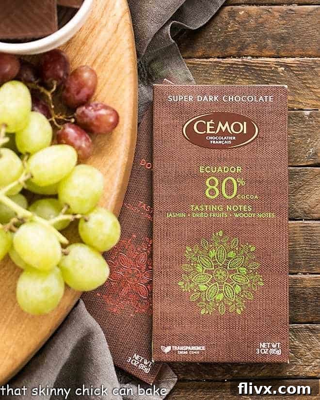 Chocolate Dessert Board - an elegant way to end a meal with top notch chocolates, fruit and cheeses artfully displayed for a jaw dropping presentation! A close-up of various Cémoi chocolate bars displayed next to a section of the Chocolate Dessert Board, emphasizing the brand's presence.