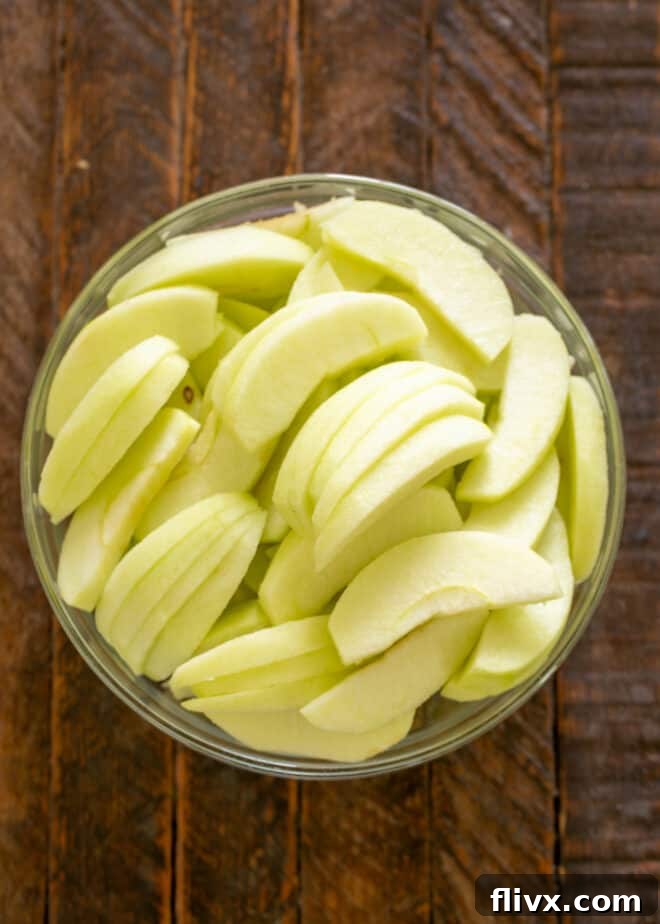 Step 2: Carefully peel, core, and slice apples into uniform pieces.