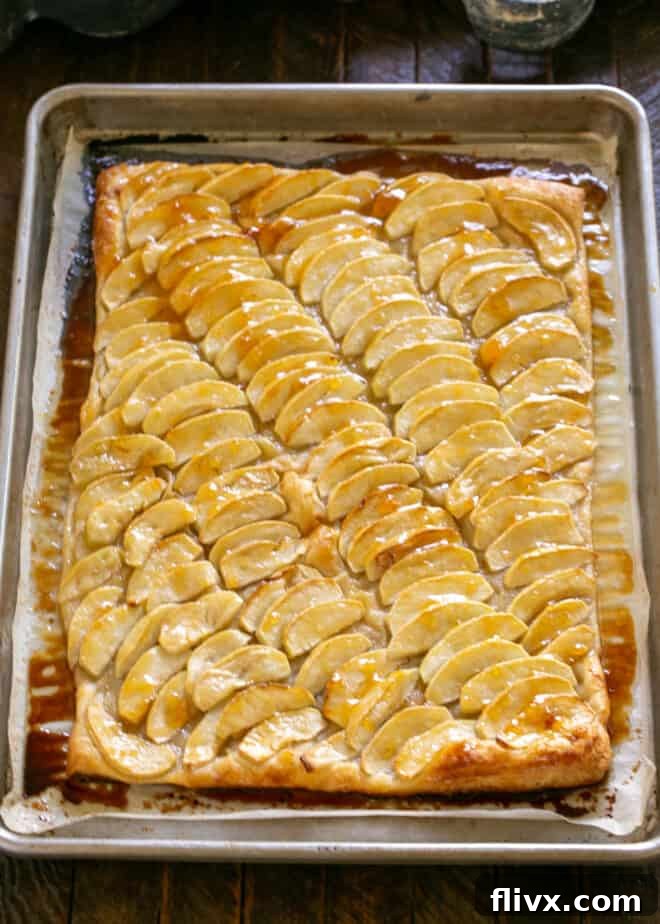 Step 7: Brush the warm, baked tart with the prepared apricot glaze for shine and flavor.