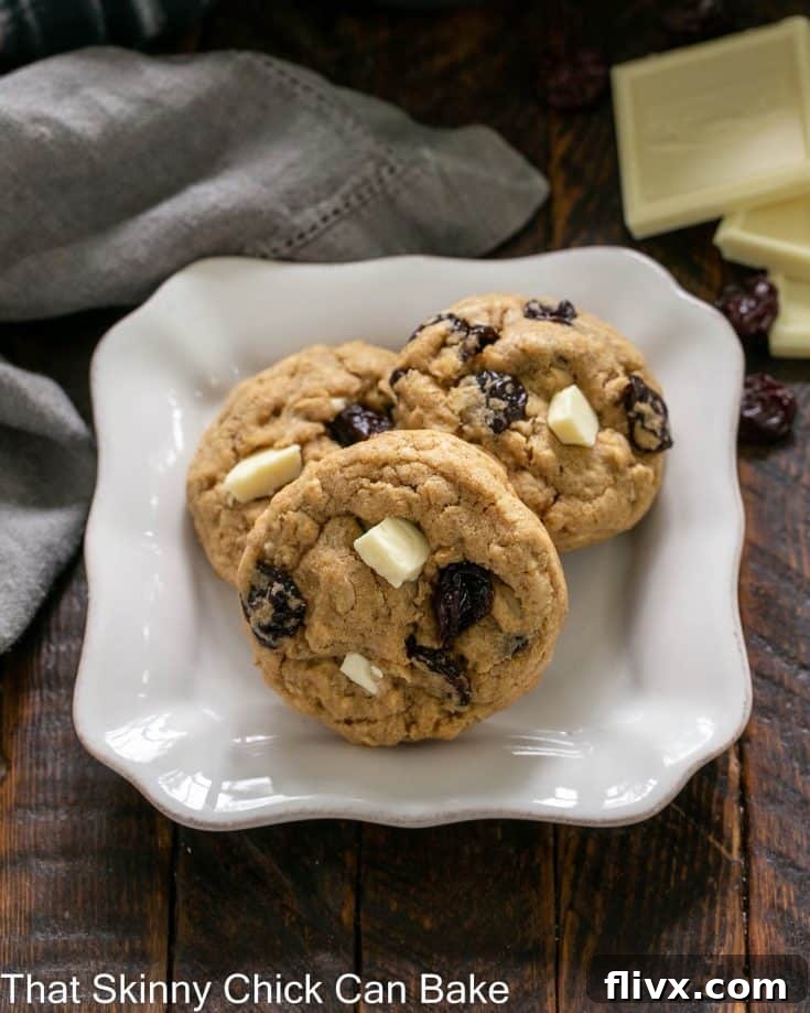 Oatmeal, Dried Cherry and White Chocolate Chunk Cookies on a square white plate