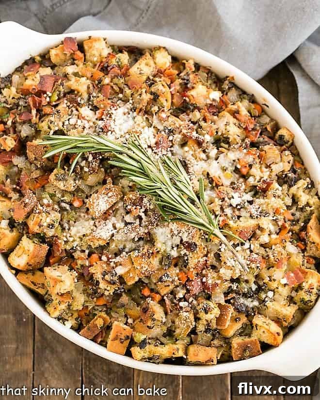 Oven Baked Stuffing - The BEST stuffing cooked outside of a turkey with an Italian twist! An overhead view showcasing the beautifully textured surface of Pancetta Ciabatta Dressing in a baking dish, garnished with a fresh sprig of rosemary.