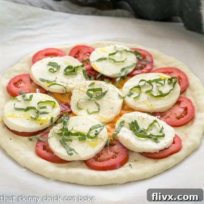 Uncooked classic pizza dough with toppings ready for the oven, showcasing fresh ingredients.