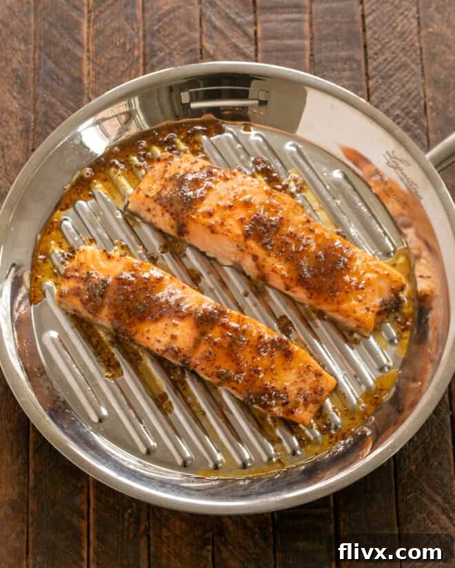 Sweet and Tangy Maple Mustard Salmon 5 Salmon fillets are seasoned with salt and pepper, then generously brushed with the maple mustard glaze before roasting.