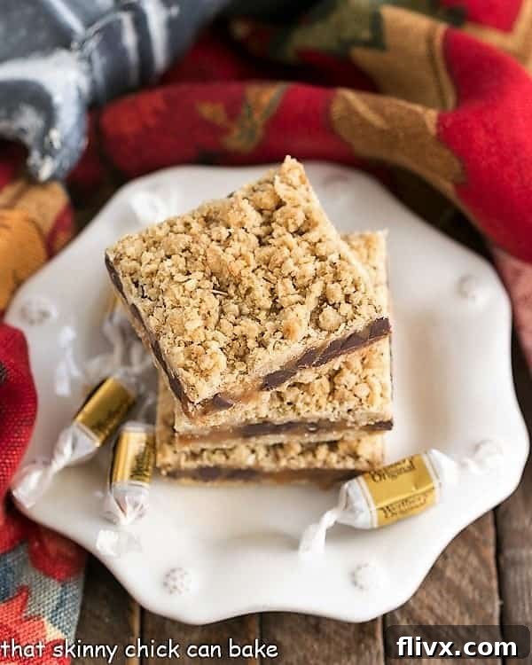 Overhead image of Oatmeal Caramel Bars stacked onto a dessert plate, highlighting the delicious layers.