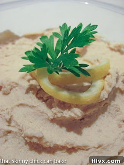 A nostalgic closeup view of classic hummus, captured in an older photograph, highlighting its timeless appeal.