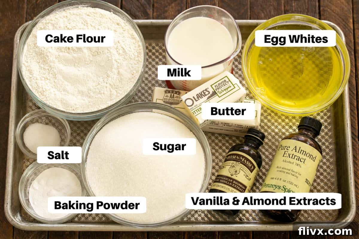 Arrangement of Classic White Layer Cake Ingredients on a baking sheet, clearly labeled for easy identification and preparation.