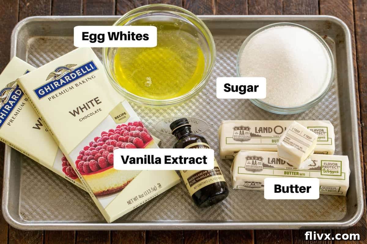 Collection of White Chocolate Swiss Meringue Buttercream Ingredients, neatly arranged and labeled on a clean surface, ready for mixing.
