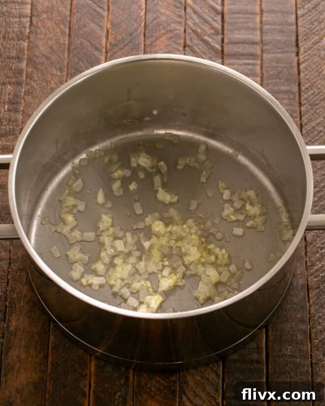 Onion and garlic cooked in butter in a large pot.