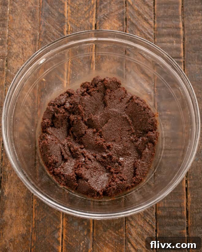 Earthquake Cookies Step 3: Mixing the chocolate and sugar mixture.