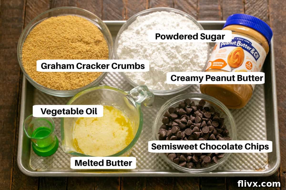 Array of essential Peanut Butter Bars Ingredients with clear labels, laid out on a sheetpan for preparation.