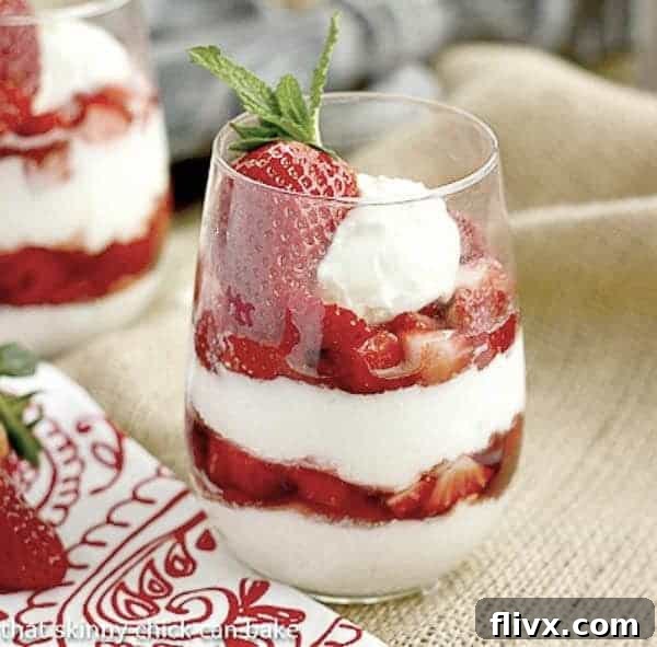 Beautifully layered Strawberry Cheesecake Parfaits, ready to be enjoyed.