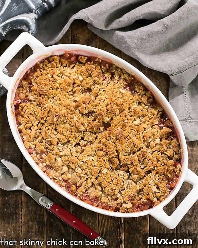 Overhead view of easy rhubarb crisp in a white casserole dish.