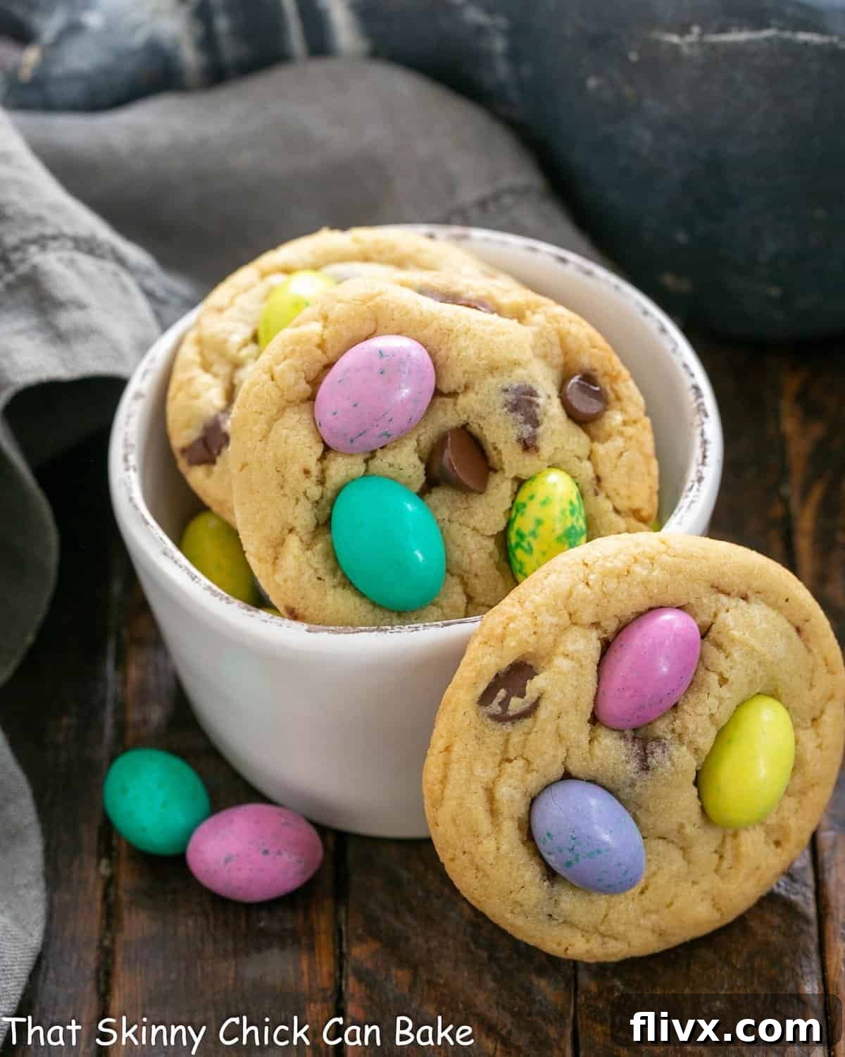 A cozy arrangement of Easter cookies nestled in a white bowl, with one cookie artfully leaning against the side, ready to be enjoyed.