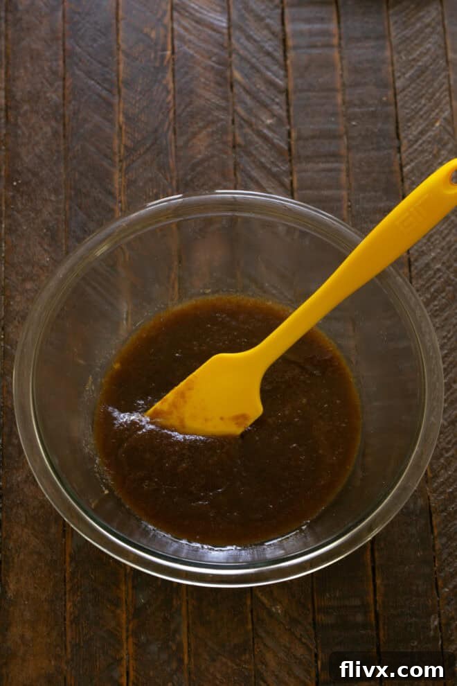 Sugars, egg, and egg yolk added to the brown butter mixture.