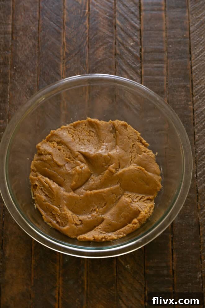 Dry ingredients (flour, baking soda, salt) being mixed into the wet batter.