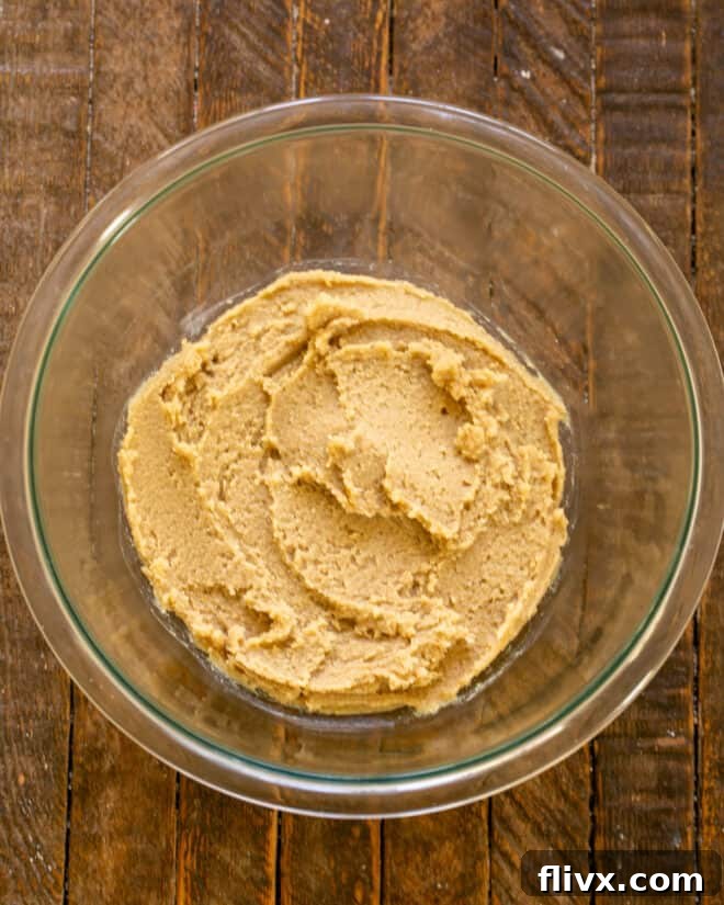 Step 1: Creaming butter and sugar together in a mixing bowl.